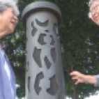 Committee members Alice Tanaka Hikido and Mary Tanaka Abo viewing George Tsutakawa's memorial sculpture entitled "Harmony". It is located near the entrance of Puyallup's Western Washington Fair Grounds. Alice and Mary were evacuated to the Puyallup Assembly Center, temporarily called Camp Harmony, in 1942 before being transported to Minidoka Internment Camp in Idaho where they were held for three years.